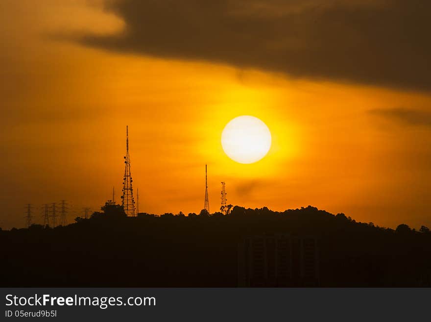 The sun setting over a satellite relay station. The sun setting over a satellite relay station.