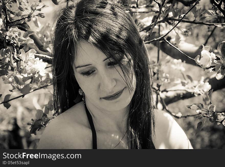 Portrait of girl with cherry flowers.