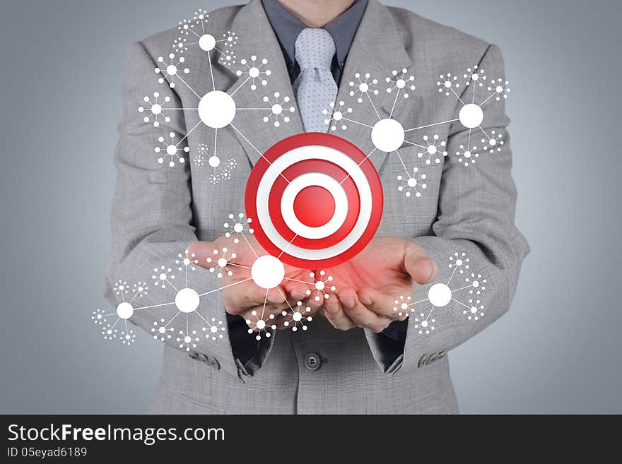 Businessman hand shows target symbol as business concept. Businessman hand shows target symbol as business concept