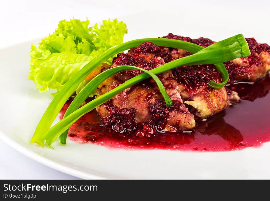 Meat in a raspberry sauce