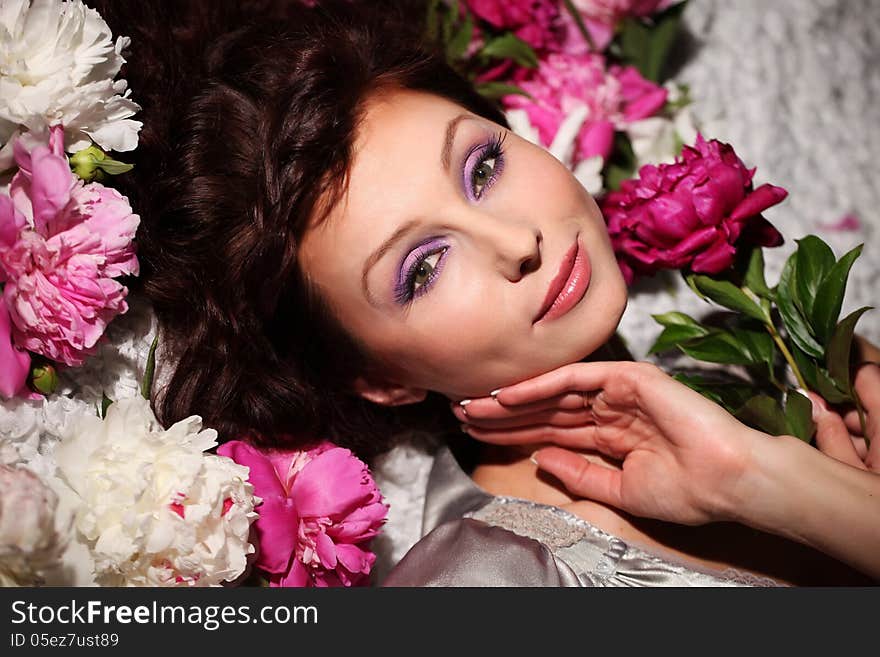 Portrait of a beautiful gentle girl with peonies. Portrait of a beautiful gentle girl with peonies.