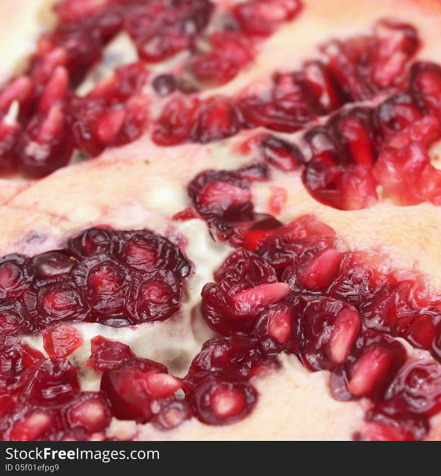 Pomegranate as a symbol of healthy eating and diet (details). Pomegranate as a symbol of healthy eating and diet (details)