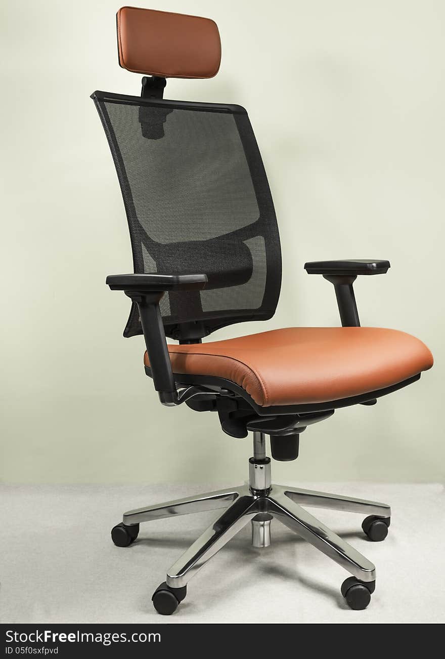 High-end office chair covered with red leather. High-end office chair covered with red leather