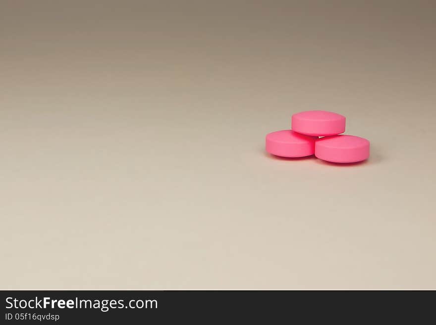 Purple pills on a neutral background. Purple pills on a neutral background