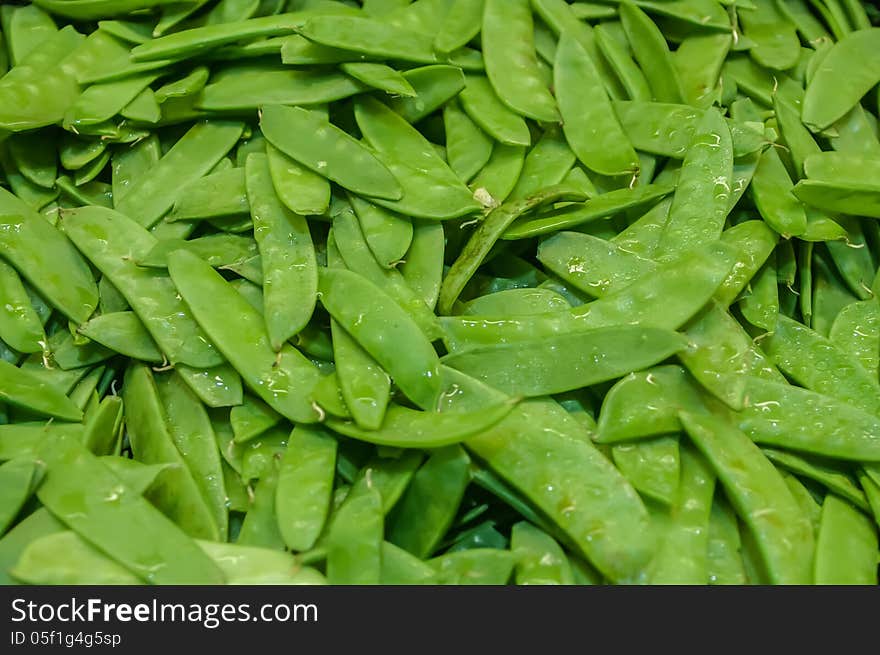 Freshly harvested peas on display at the farmers market