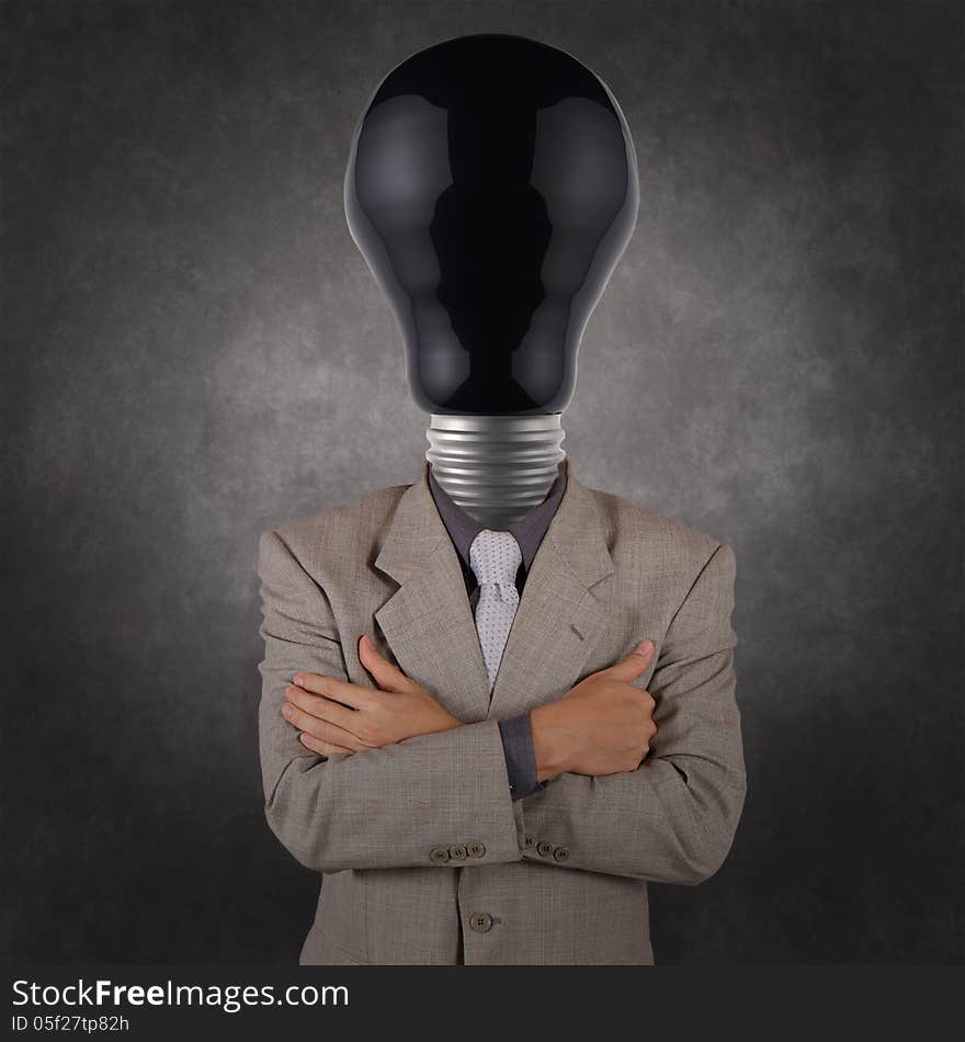 Businessman with black light bulb head as concept