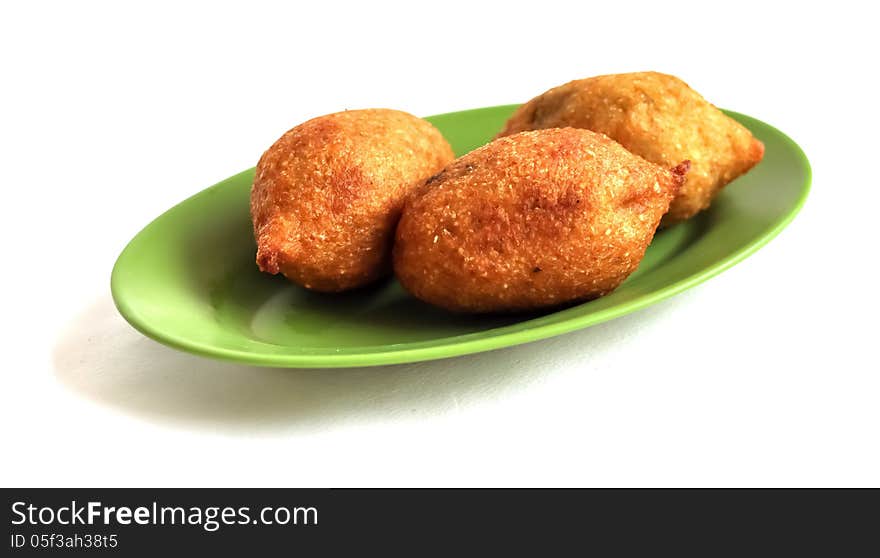 Kibbeh, a traditional middle eastern recipe, made out of meat and burghul ... in a green plate