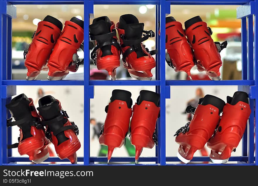 Six pairs of red skating boots, each placed within intersecting squares. Six pairs of red skating boots, each placed within intersecting squares