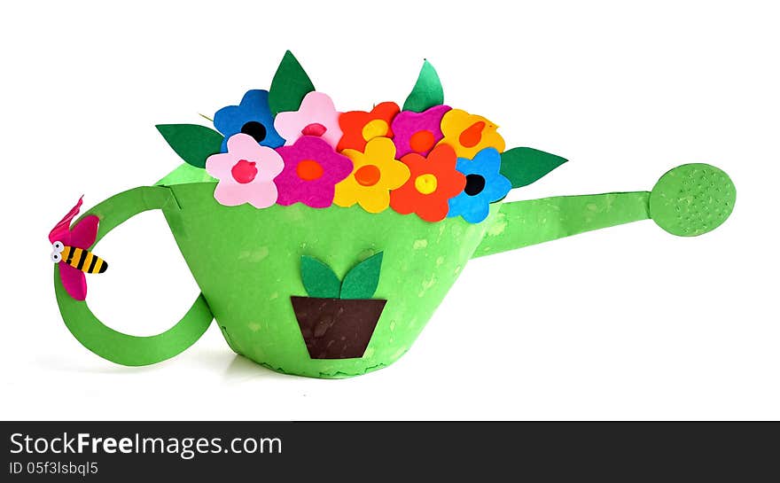 A watering pot made by a young child using colored card boards. A watering pot made by a young child using colored card boards