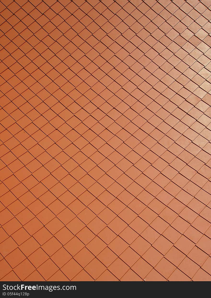 Pattern of ancient red roof in sunlight