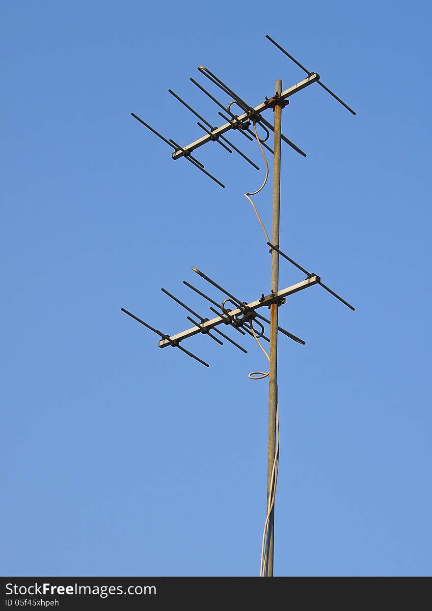 Hight receiver antenna in sunlight and blue sky. Hight receiver antenna in sunlight and blue sky