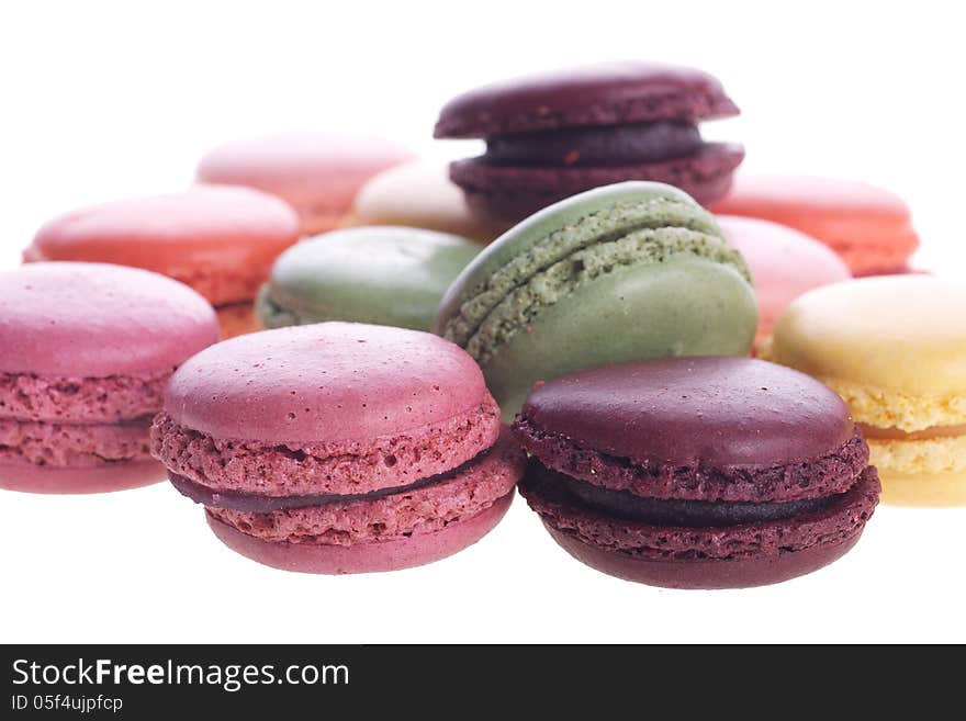 Picture of different colored macaroons on a white isolated background