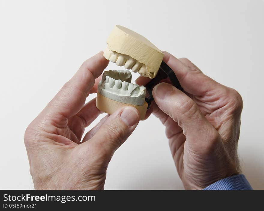 Man holding dental mold