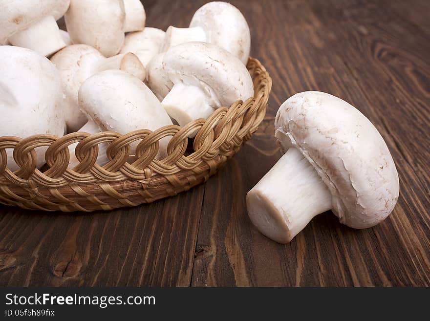 Mushrooms on a wooden background close-up