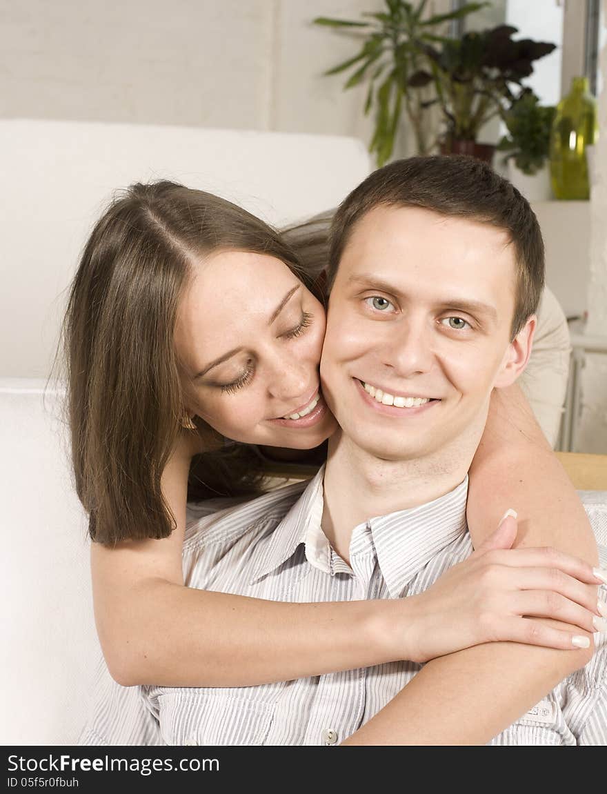 Close Up Portrait Of Pretty Young Couple. Man And Woman Hugging