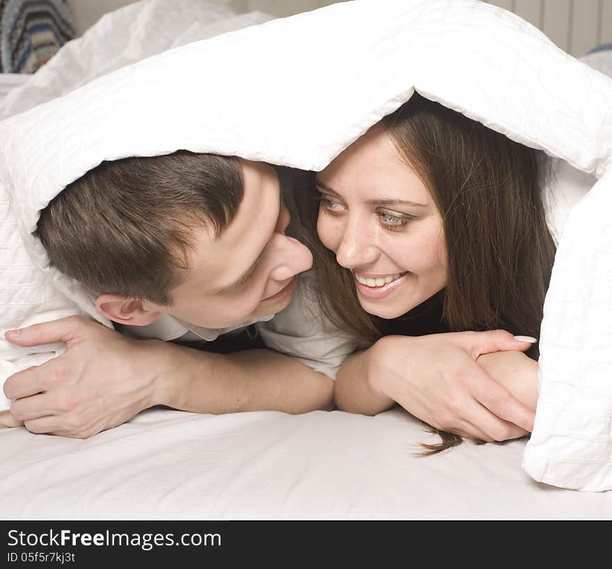 Close Up Portrait Of Pretty Young Couple. Man And Woman Hugging