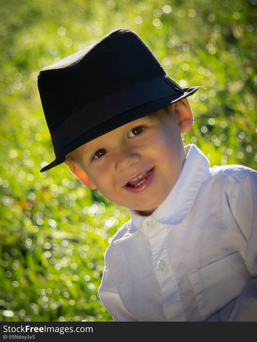 Young Smiling Boy in Black Hat