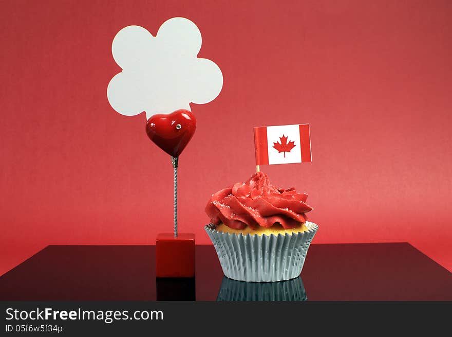 Canadian Cupcake With Maple Leaf Flag And Sign