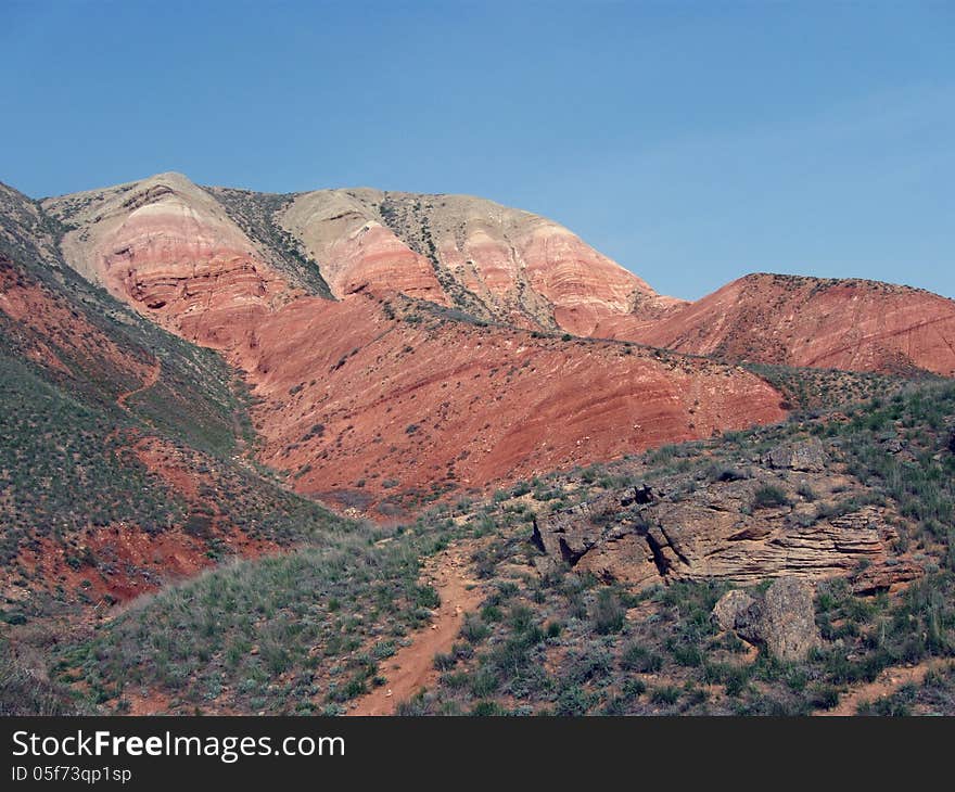 Big Bogda Mountain in the Astrakhan steppes, red hill in the desert