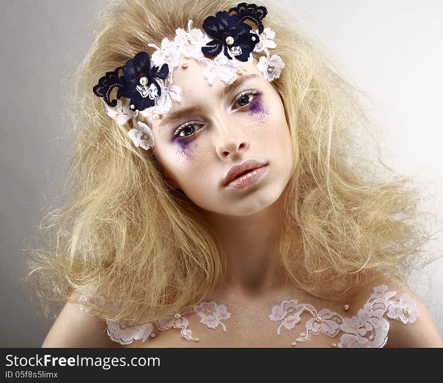 Young Styled Blonde With Colorful Makeup - Blue Eye Shadows. Arts