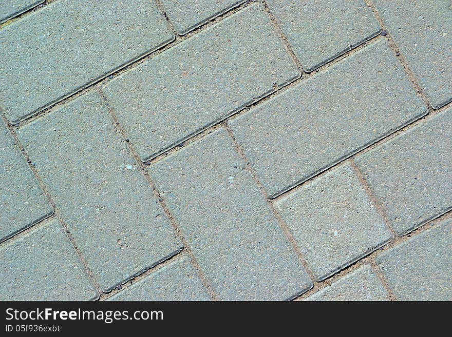 Gray paving bricks on a walkway