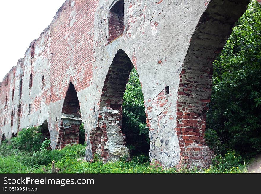 Old broken brick wall outdoor in the forest