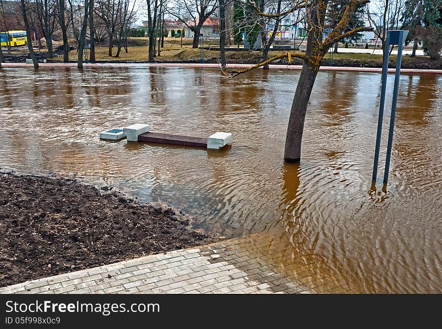 Urban river embankment submerged by flood