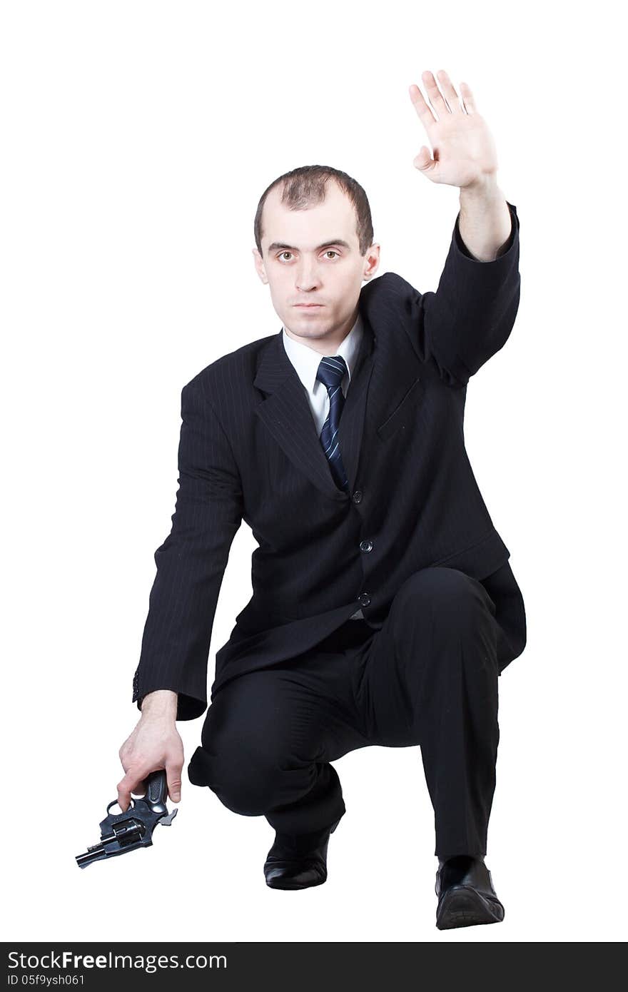 Professional man who keeps a gun pointing it at a target on a white background. Professional man who keeps a gun pointing it at a target on a white background