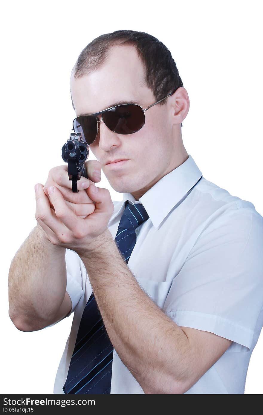 Professional man who keeps a gun pointing it at a target on a white background. Professional man who keeps a gun pointing it at a target on a white background