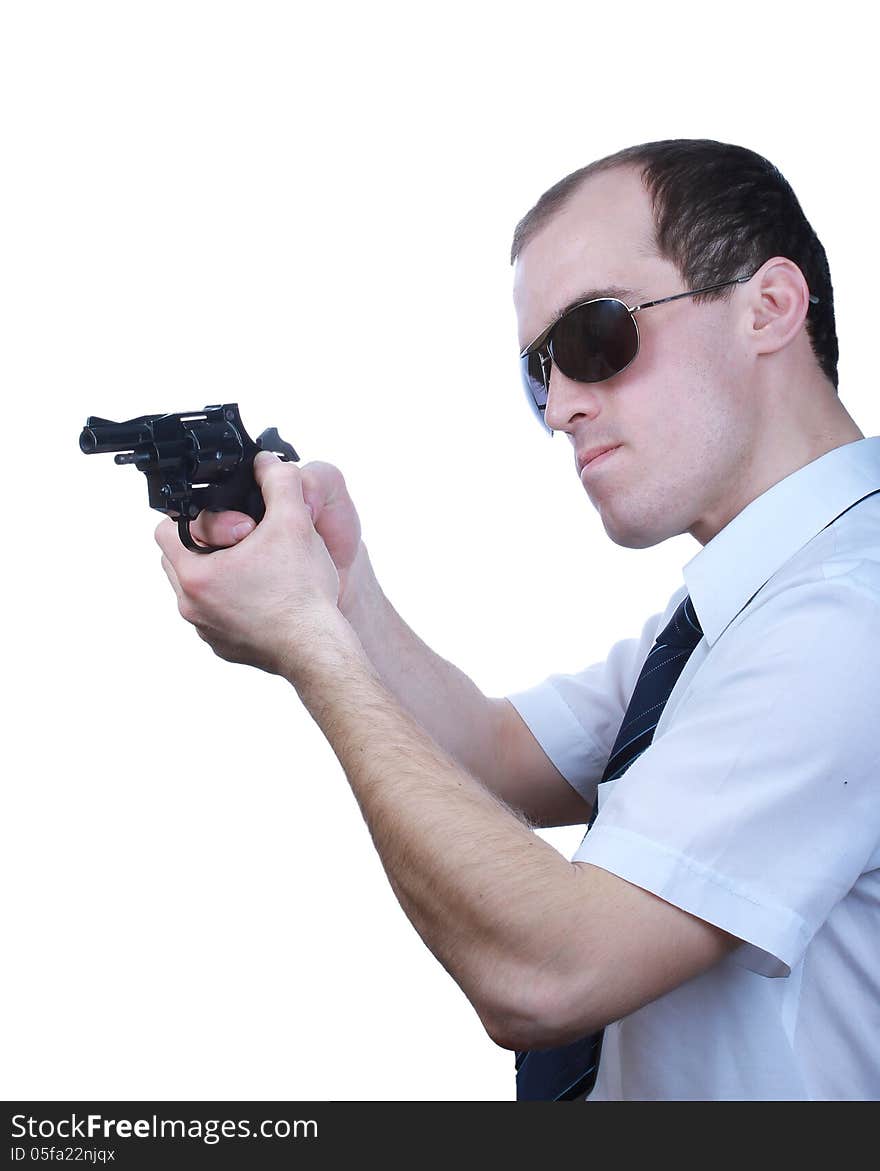 Professional man who keeps a gun pointing it at a target on a white background. Professional man who keeps a gun pointing it at a target on a white background