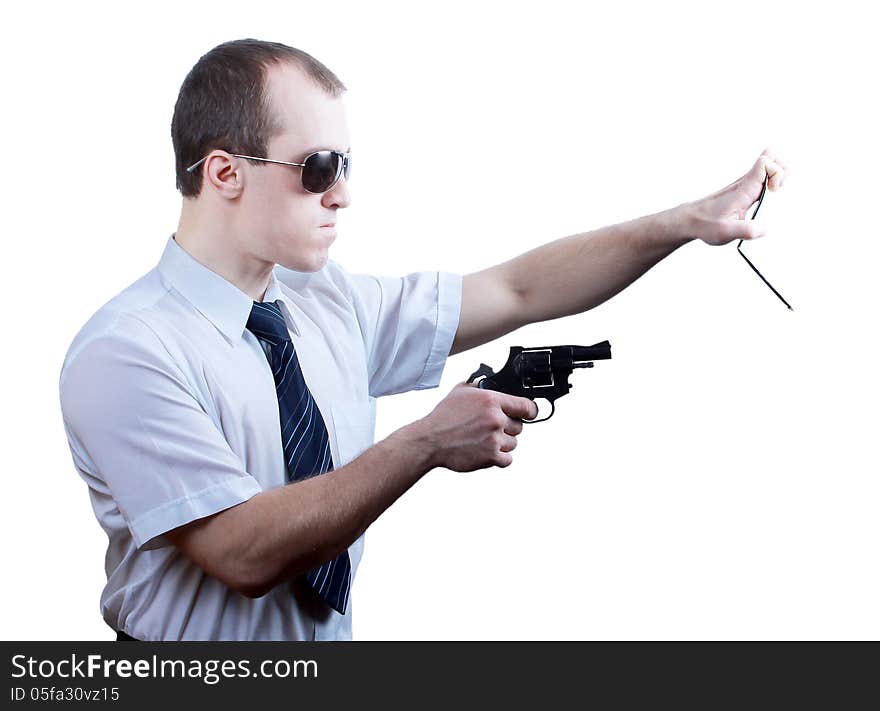 Professional man who keeps a gun pointing it at a target on a white background. Professional man who keeps a gun pointing it at a target on a white background