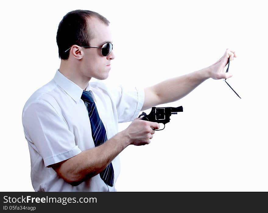 Professional man who keeps a gun pointing it at a target on a white background. Professional man who keeps a gun pointing it at a target on a white background