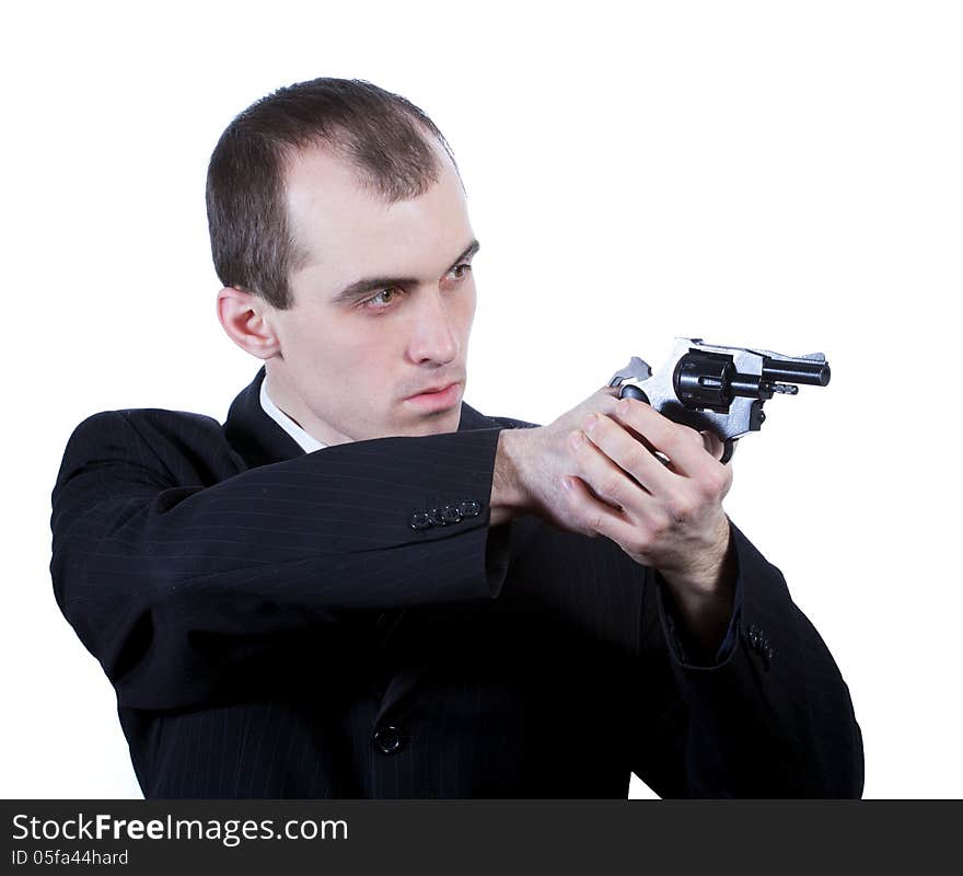 Professional man who keeps a gun pointing it at a target on a white background. Professional man who keeps a gun pointing it at a target on a white background