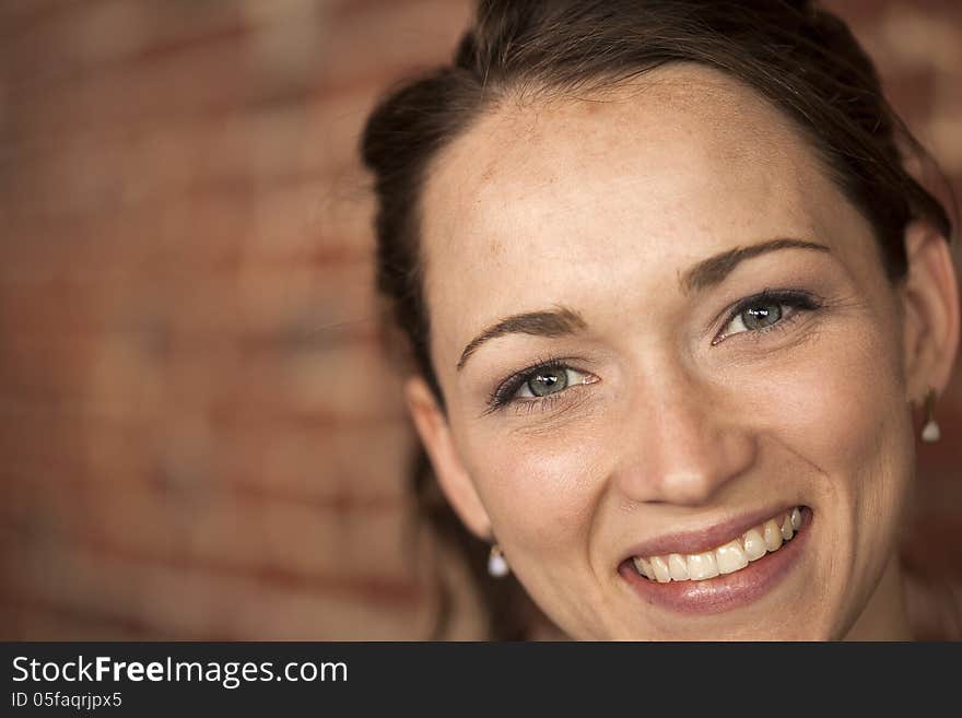 Young Woman with Beautiful Green Eyes and Brown Hair