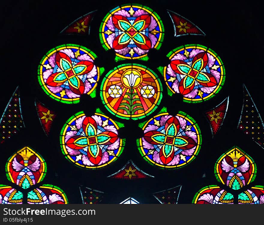 The stained glass window in a votive church, Vienna