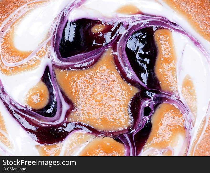 Cake with blueberry jam and cream.