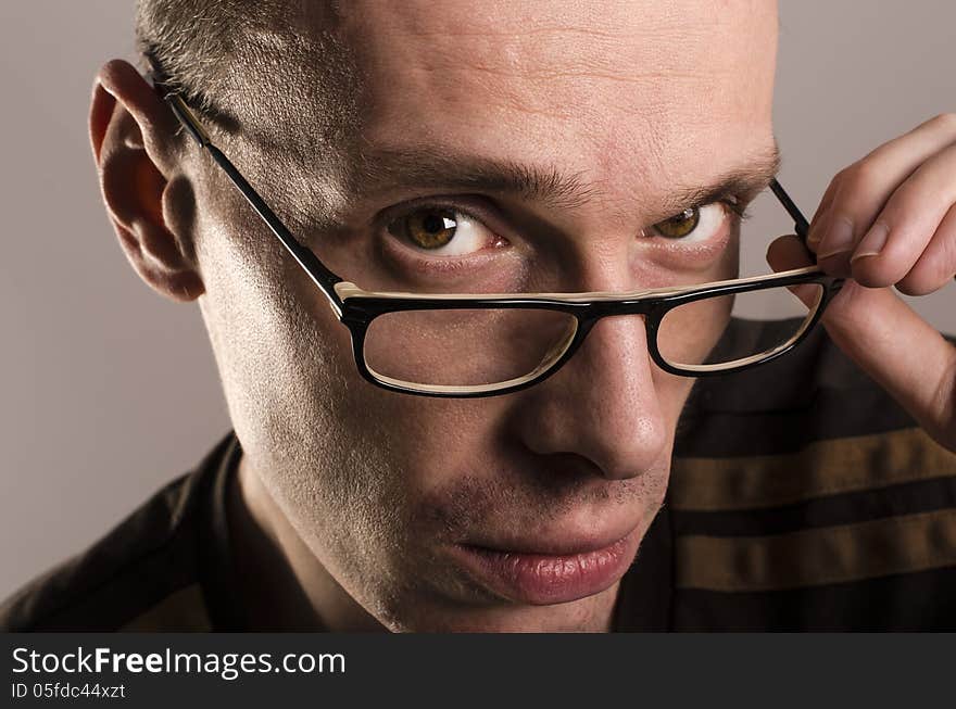 A handsome young man with glasses