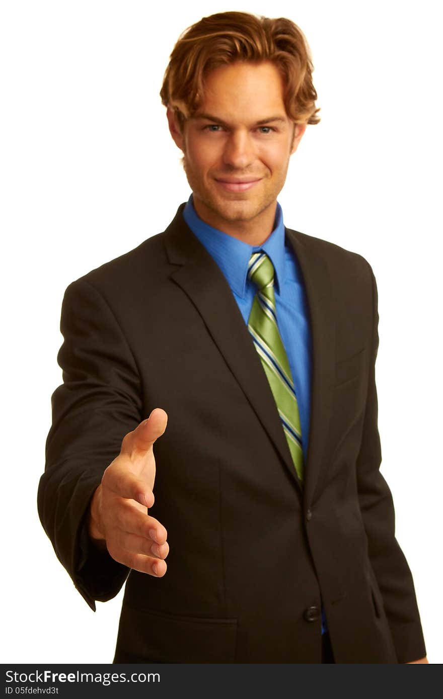 Business man in suit offering a handshake isolated on white background.