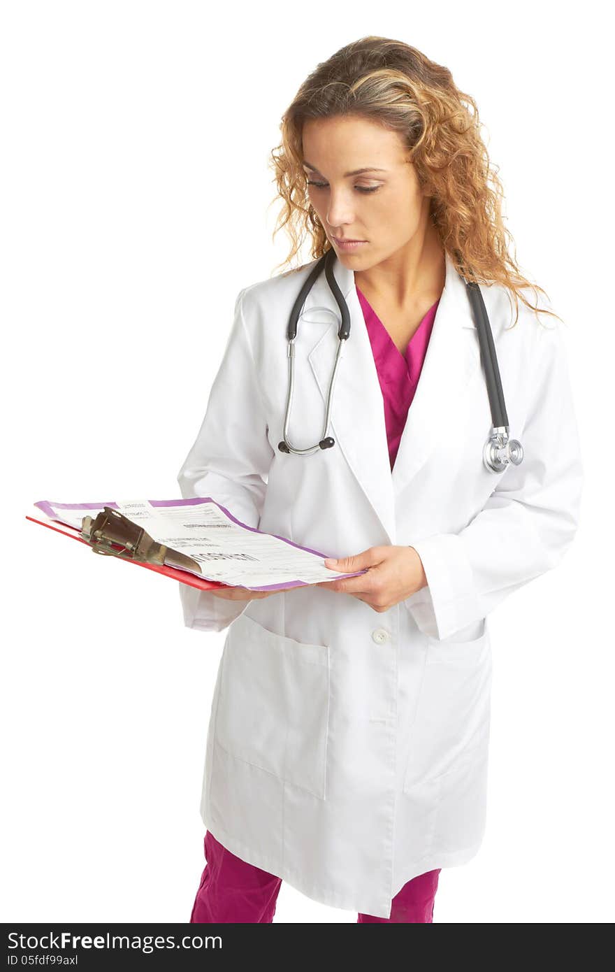 Serious young female doctor looking at chart