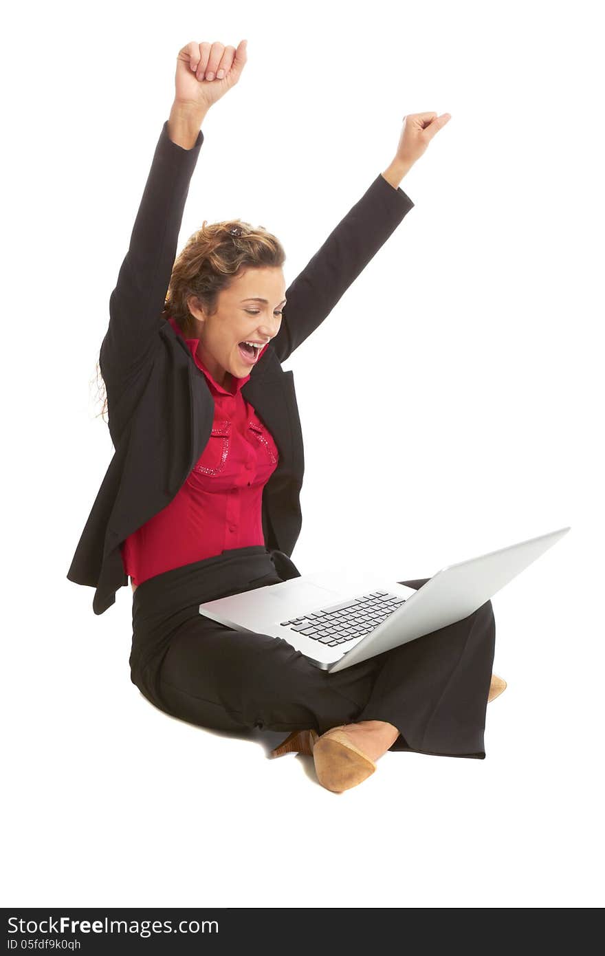 Beautiful caucasion female with laptop excited isolated on white. candid, vertical shot.