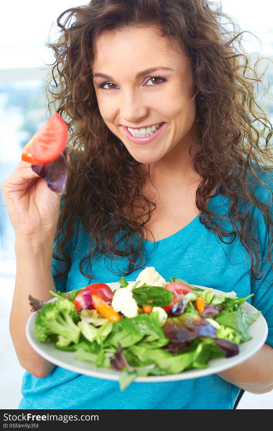 Beautiful Happy Female Eating A Salad