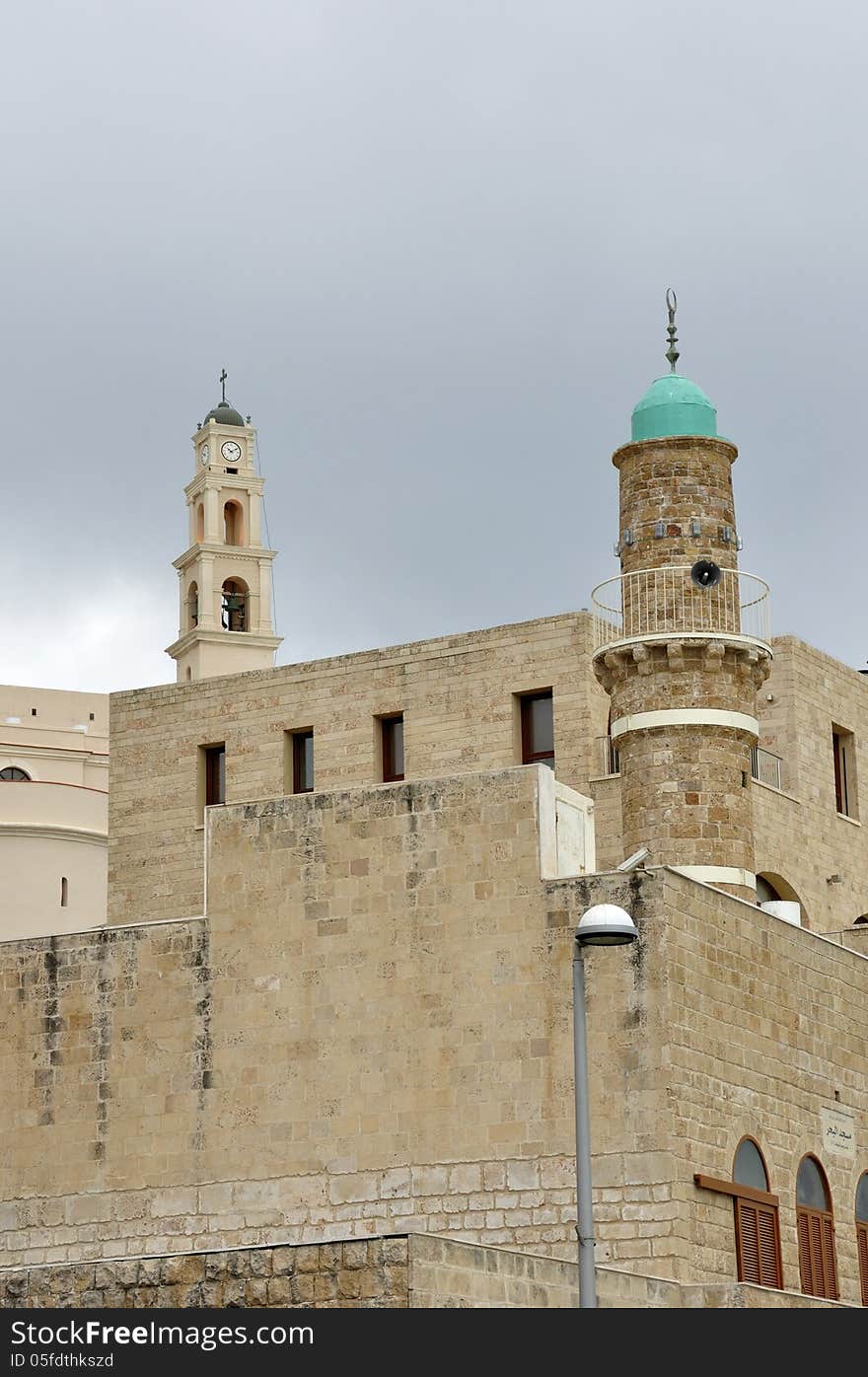 Proximity of the Christian St. Peter's Church and the Muslim Jama-el-Bahr Mosque (Sea Mosque) in Jaffa, Israel; March 4, 2013. Proximity of the Christian St. Peter's Church and the Muslim Jama-el-Bahr Mosque (Sea Mosque) in Jaffa, Israel; March 4, 2013