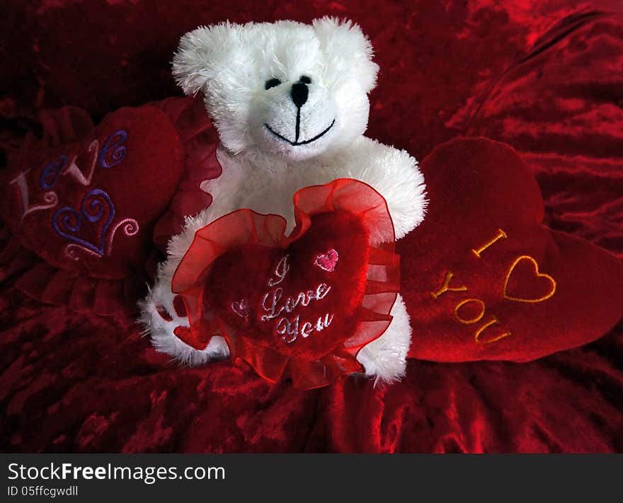 Teddy with red hearts