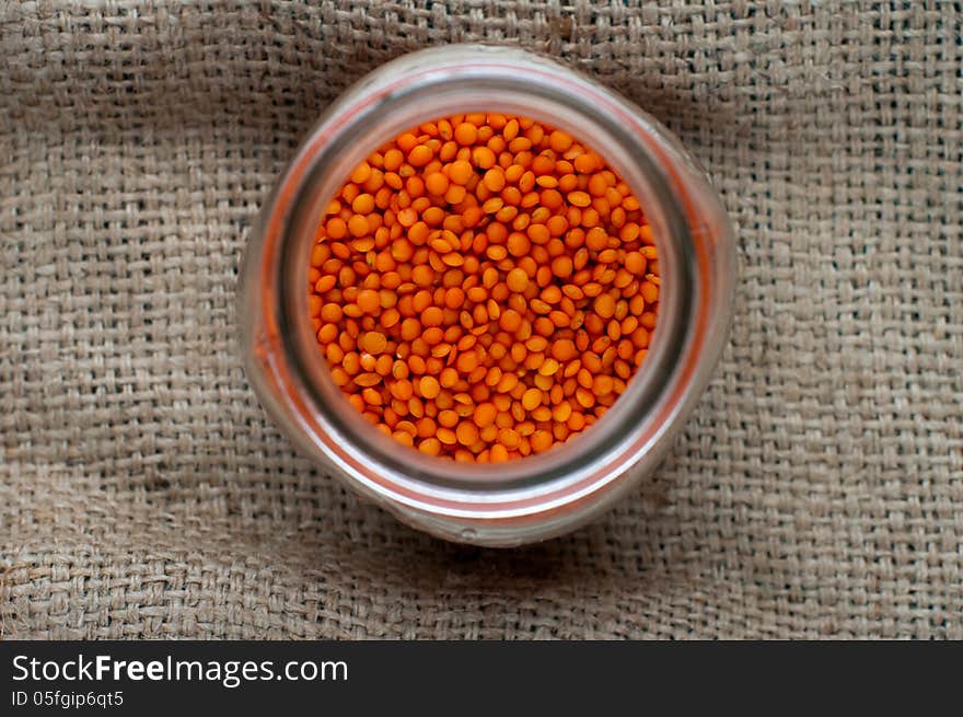 Jar of lentils set on a sackcloth