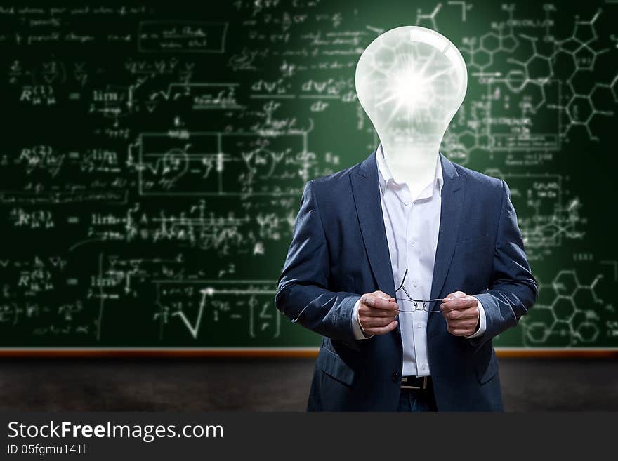 Teacher or college professor with a light bulb head in front of a chalkboard with complex math problems. Teacher or college professor with a light bulb head in front of a chalkboard with complex math problems.