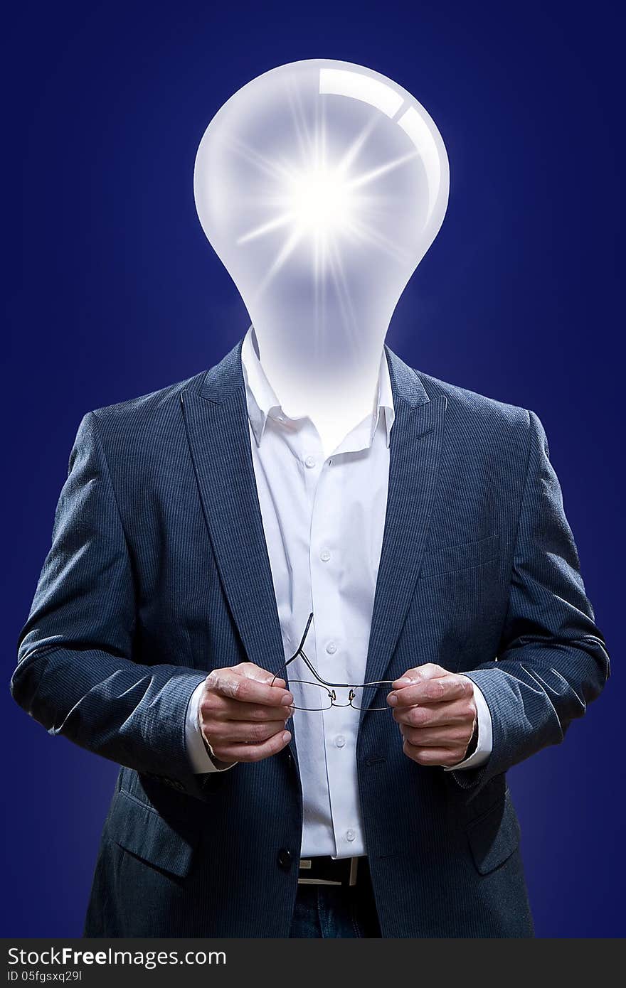 Businessman with a light bulb head and blue background. To illustrate people with ideas. Businessman with a light bulb head and blue background. To illustrate people with ideas.