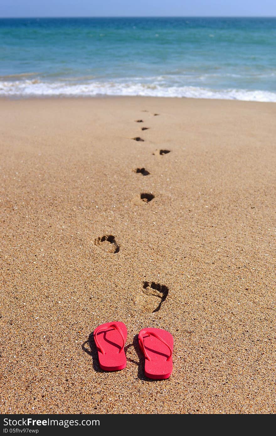 Sandles and Foot Steps in the Sand