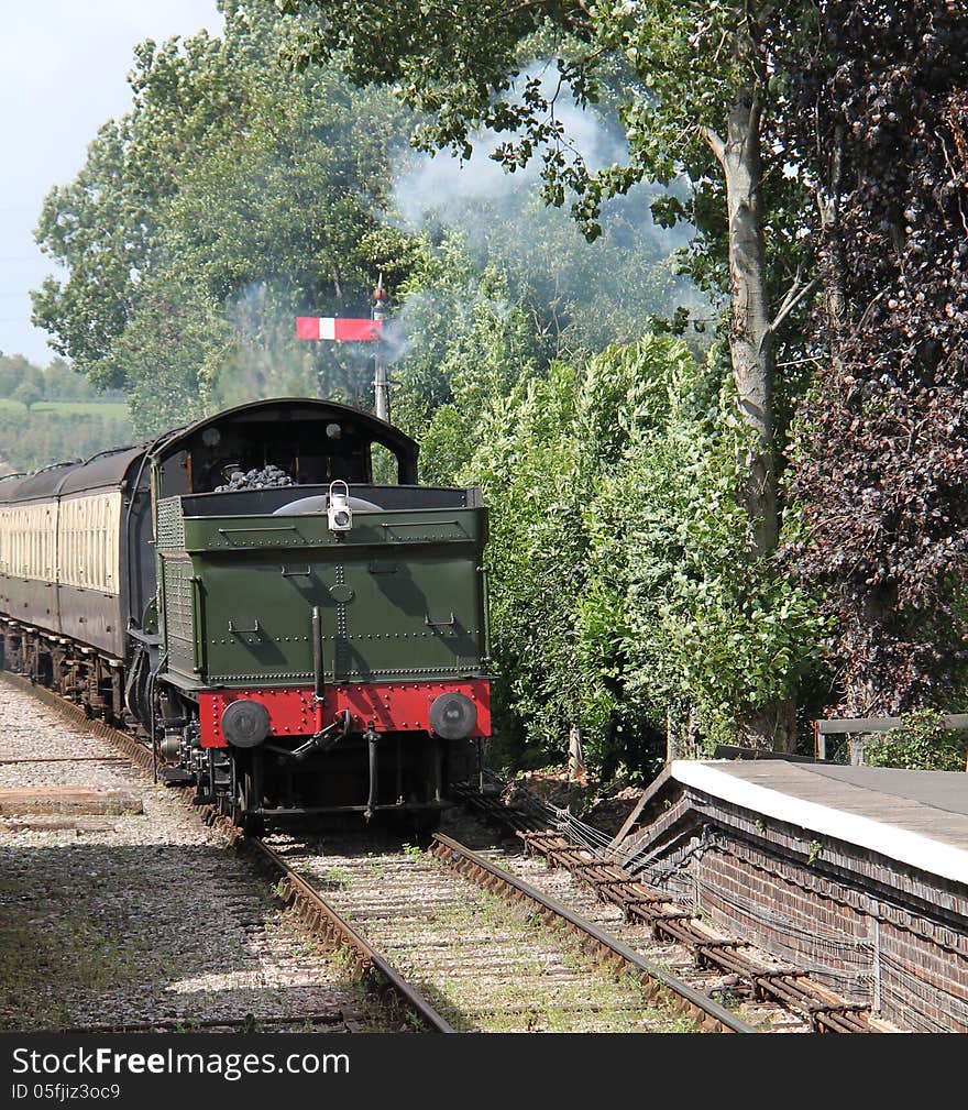 A Steam Engine Pulling a Train Backwards into a Station. A Steam Engine Pulling a Train Backwards into a Station.