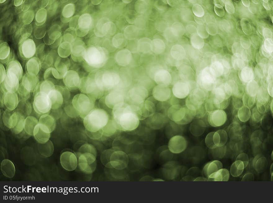 Abstract circular green bokeh background.