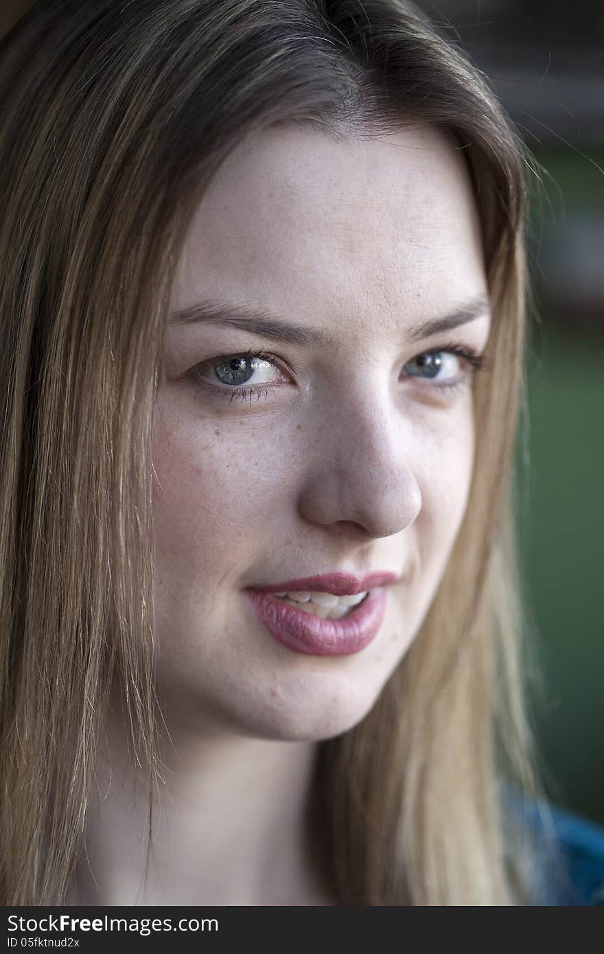 Portrait of a blonde woman with blue eyes. Portrait of a blonde woman with blue eyes.